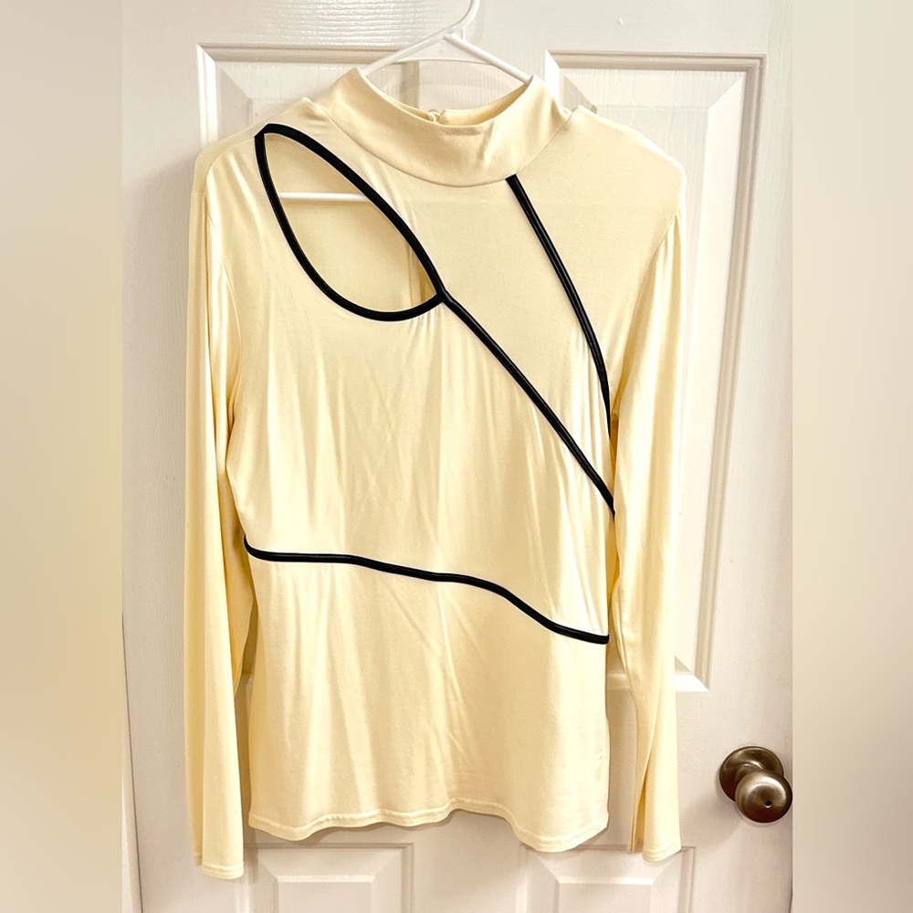 Cream colored long sleeve with faux leather pipping detail